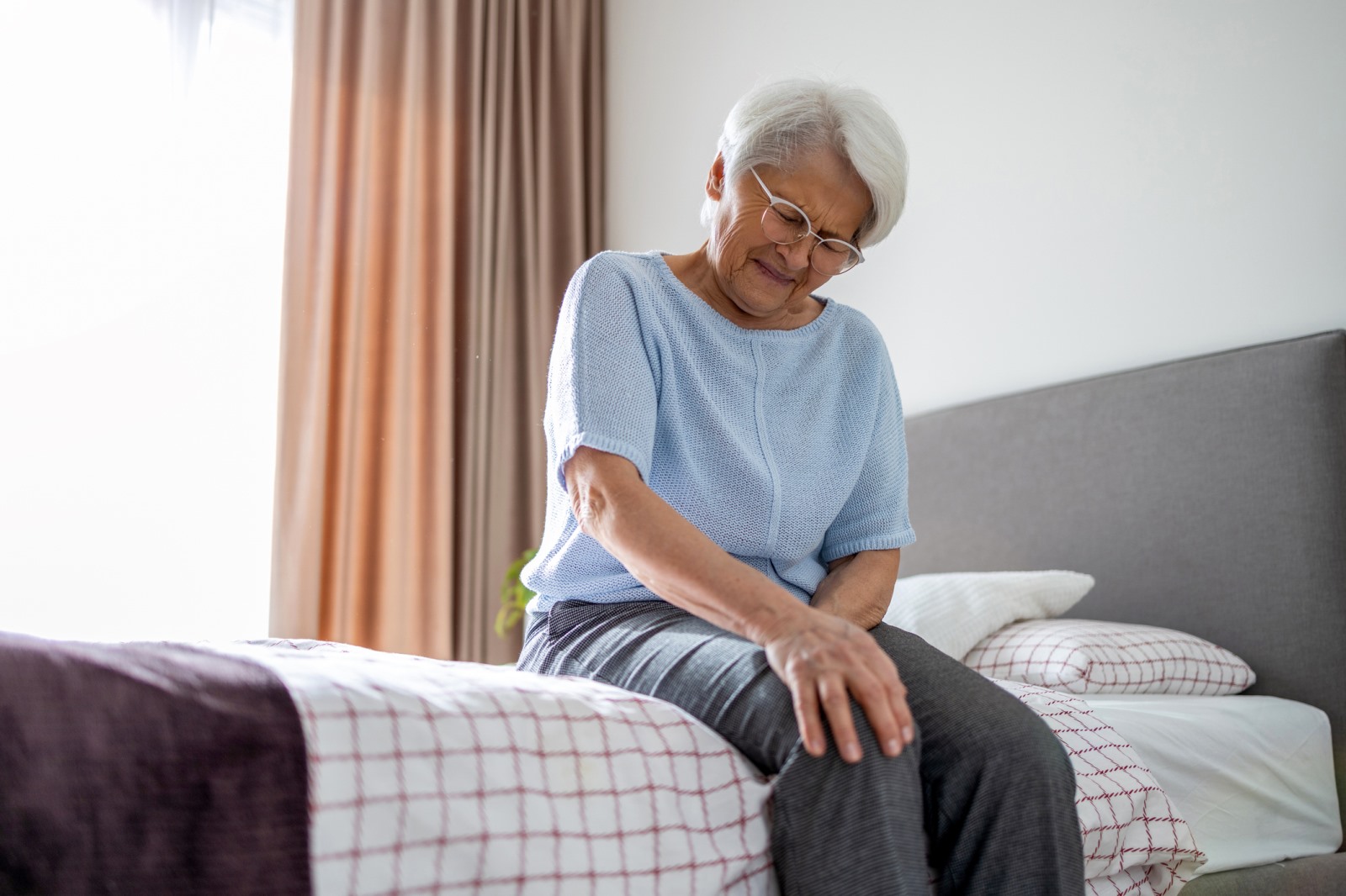 Senior Female Medicare Patient in Pain Photo