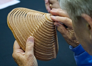 One of Bill Luce’s sandblasted fir pieces being examined
