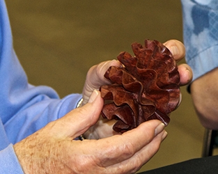 A participant explores one of Andi’s pieces with her fingers
