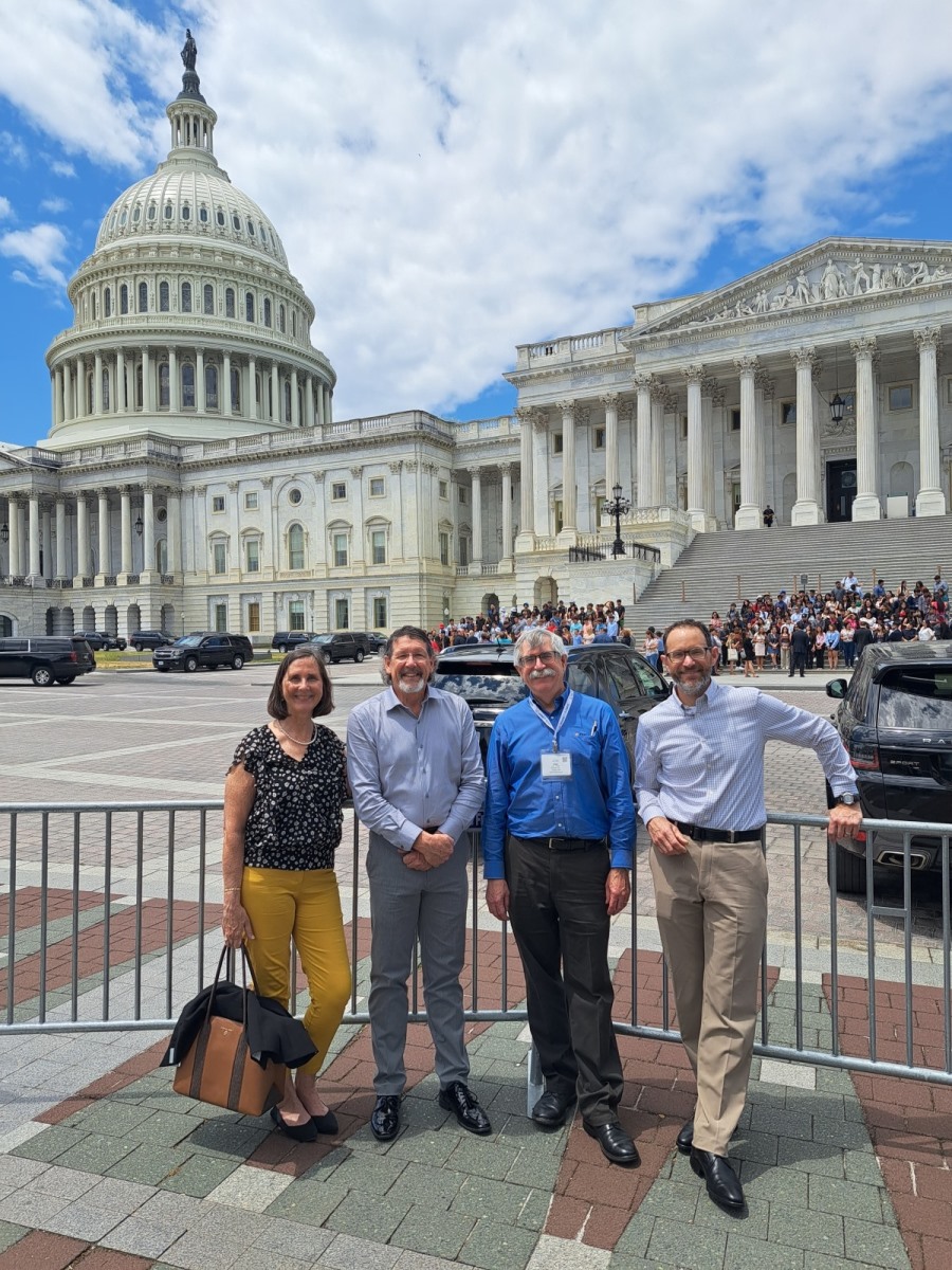 ACEC Members pose in front of the Capitol building.