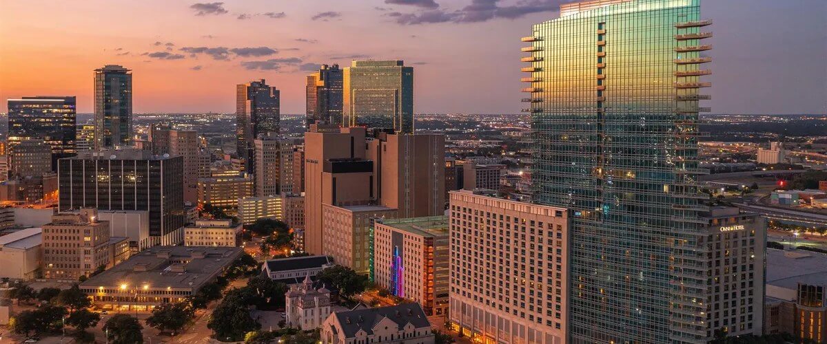 Omni Fort Worth Hotel and the downtown Fort Worth skyline at dusk