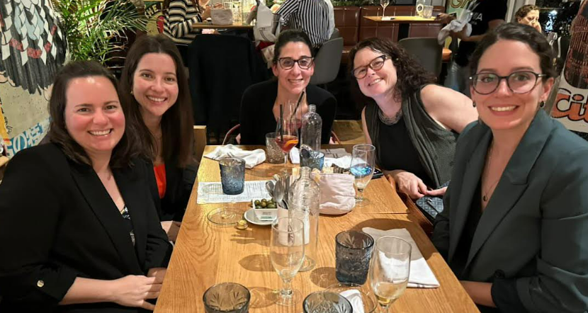 A group of women sitting at a tableDescription automatically generated