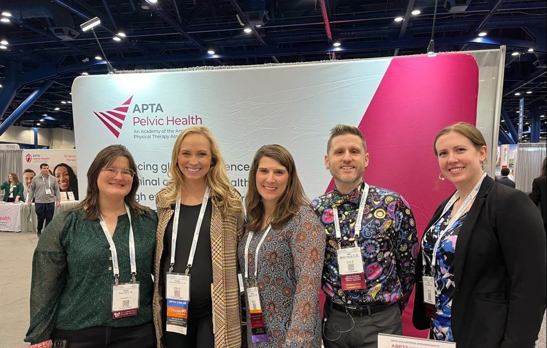 Academy community members gathered at a past CSM exhibit booth