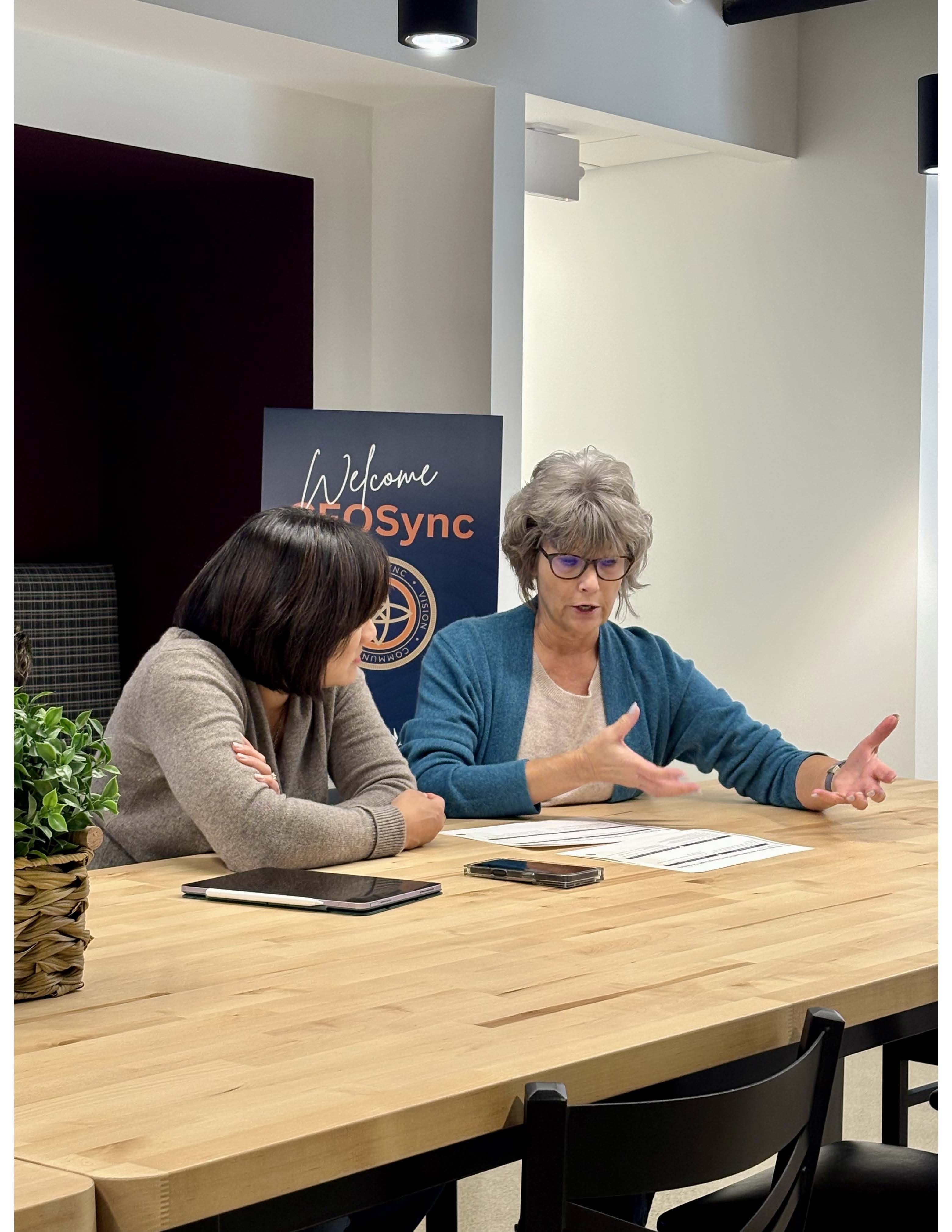 Two CEOSync leaders working through an issue together