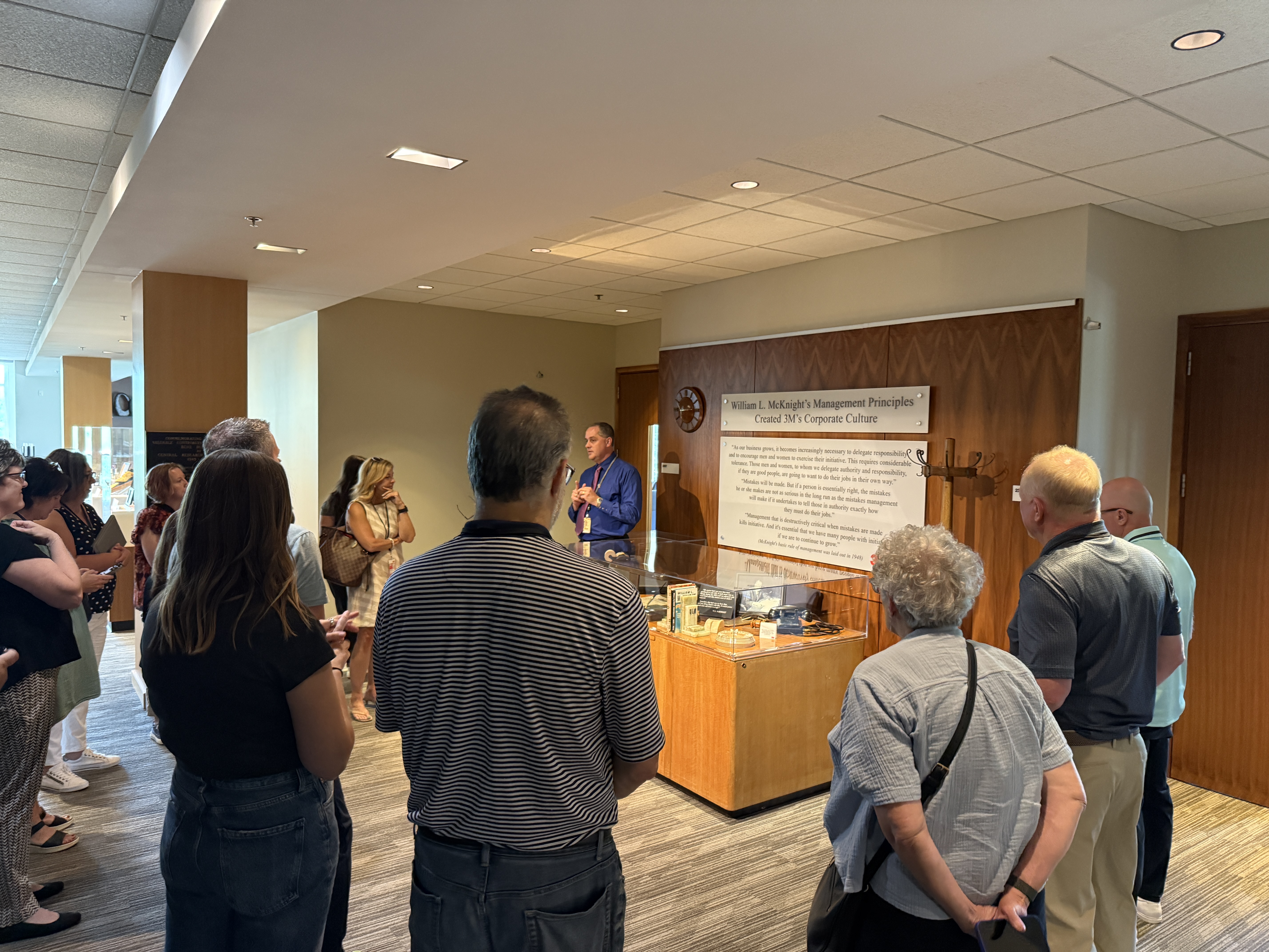 SyncUp participants listening and learning during a 3M tour