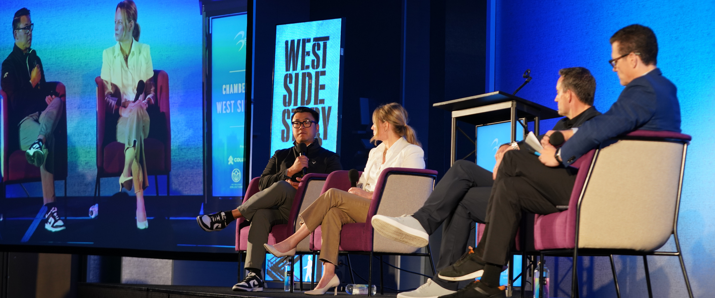 Panelists on stage at a Bellevue Chamber conference