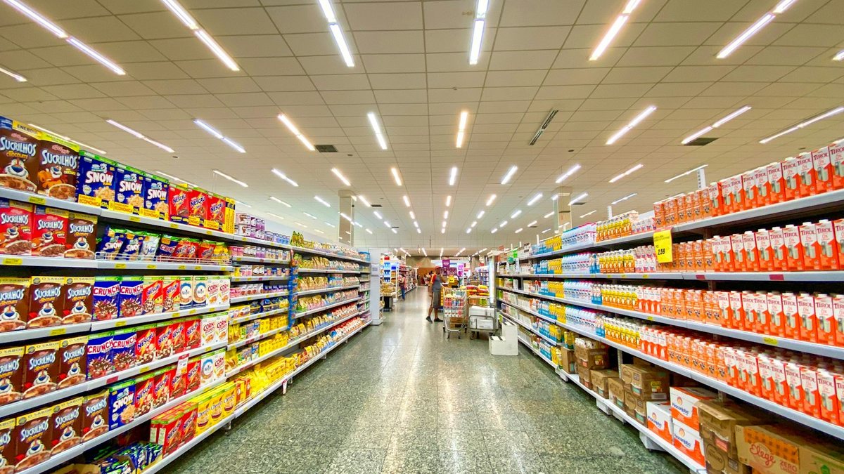 A brightly lit grocery store aisle