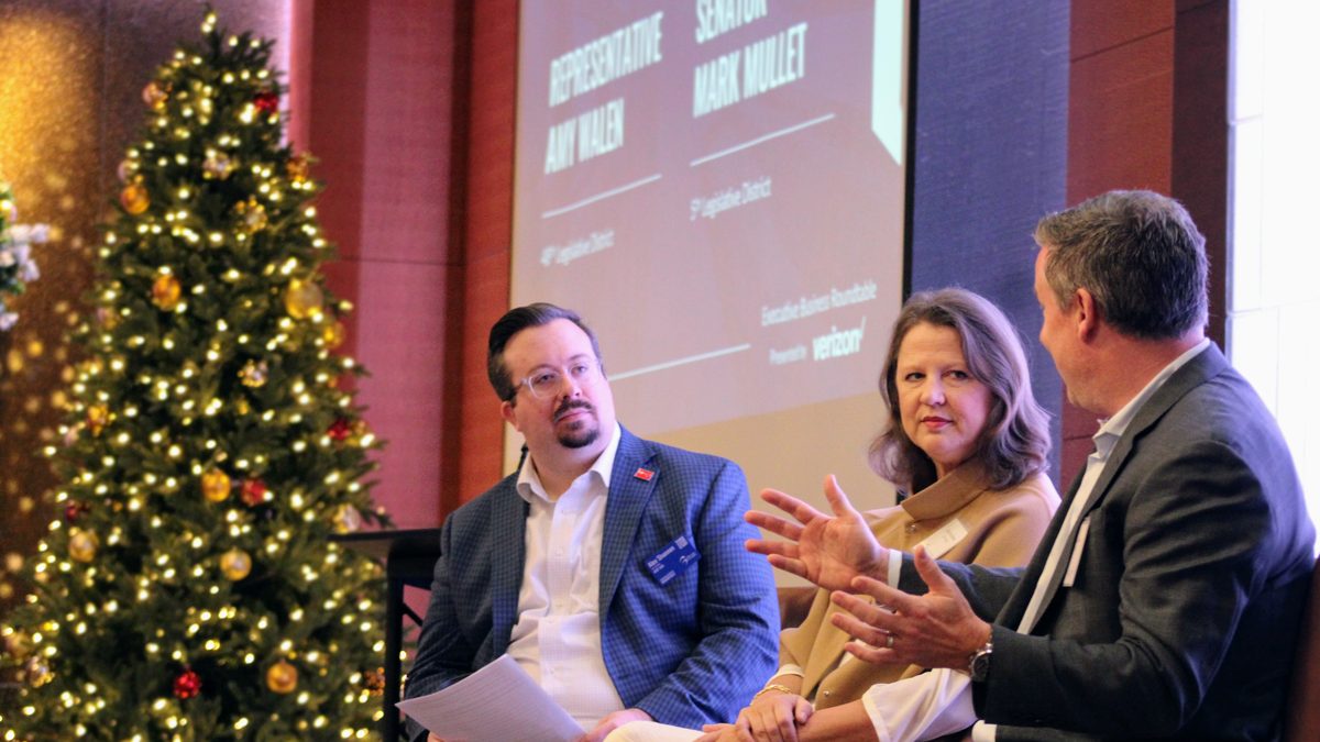 State legislators in conversation on stage at an Executive Business Roundtable breakfast