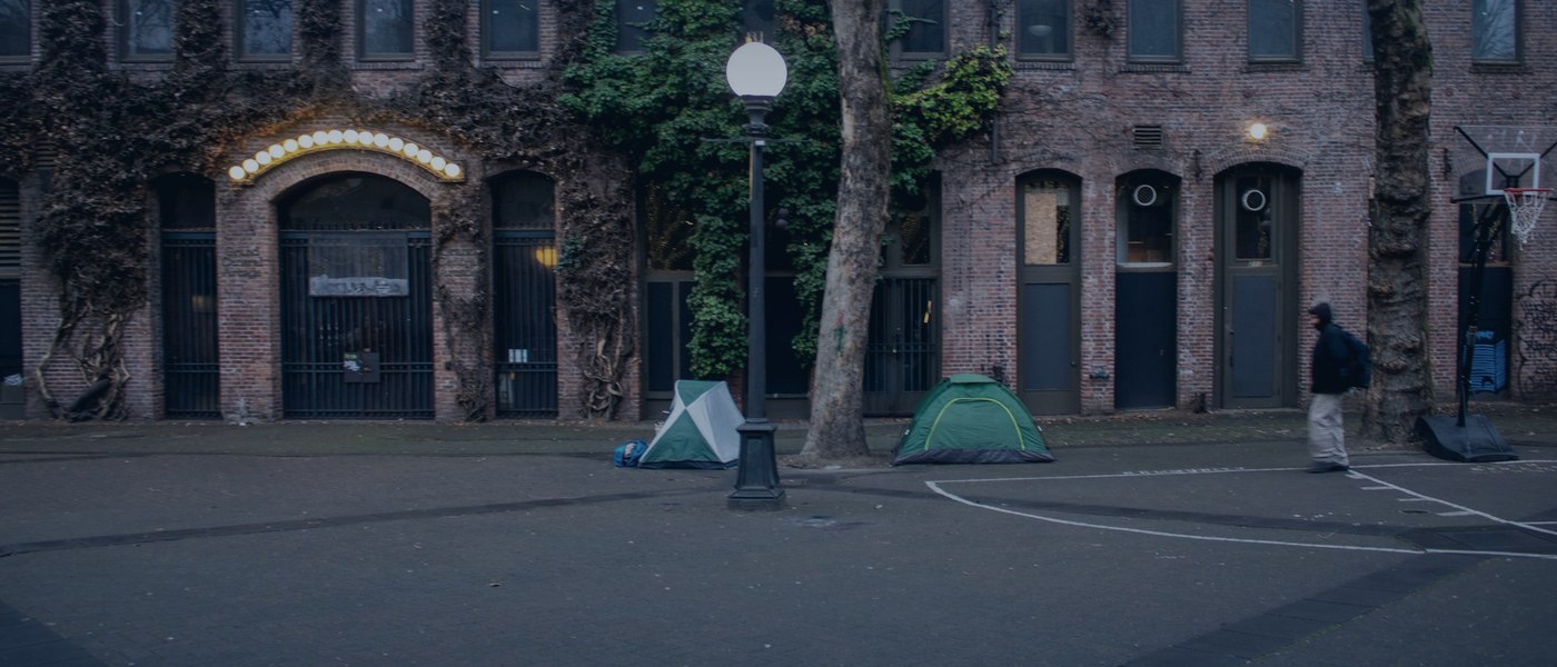 Tents beneath a highway overpass