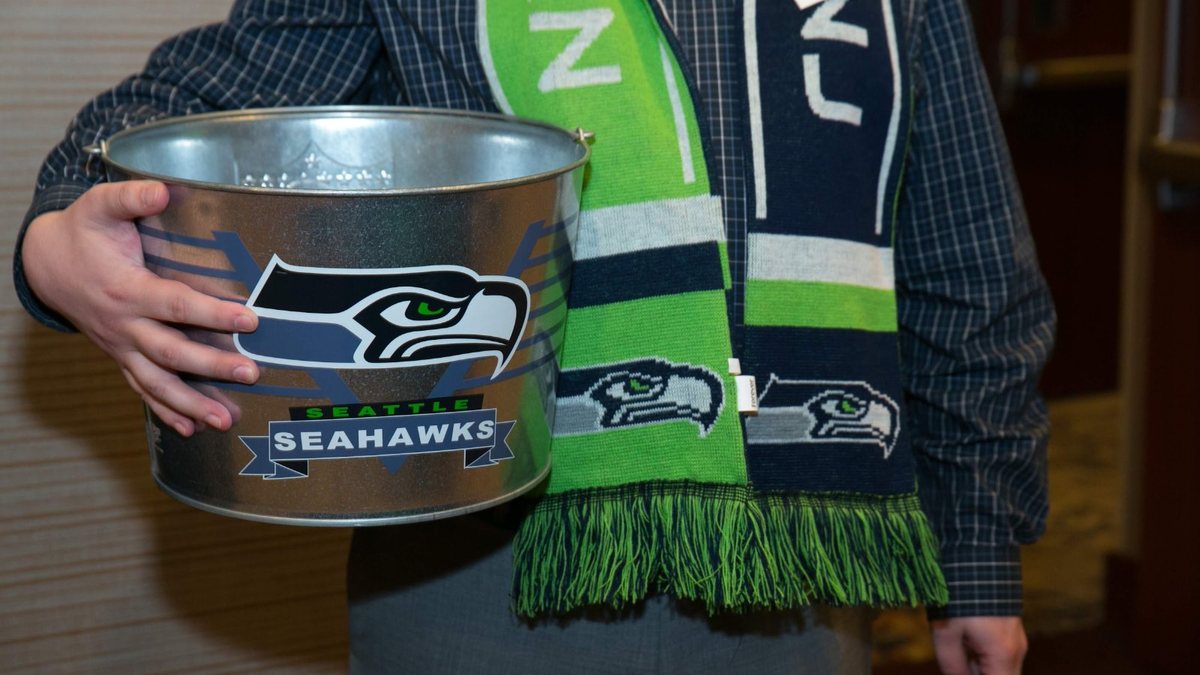 A Seahawks bucket and scarf at a Chamber event