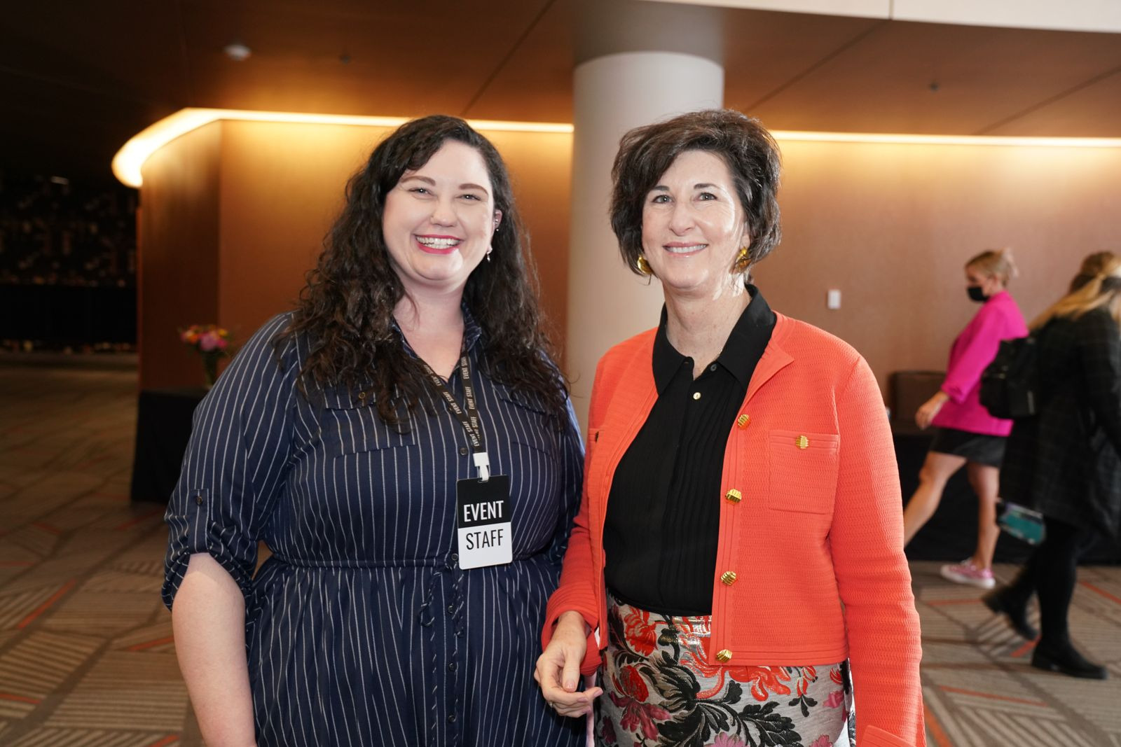 Two Chamber event staff members in the lobby before a program
