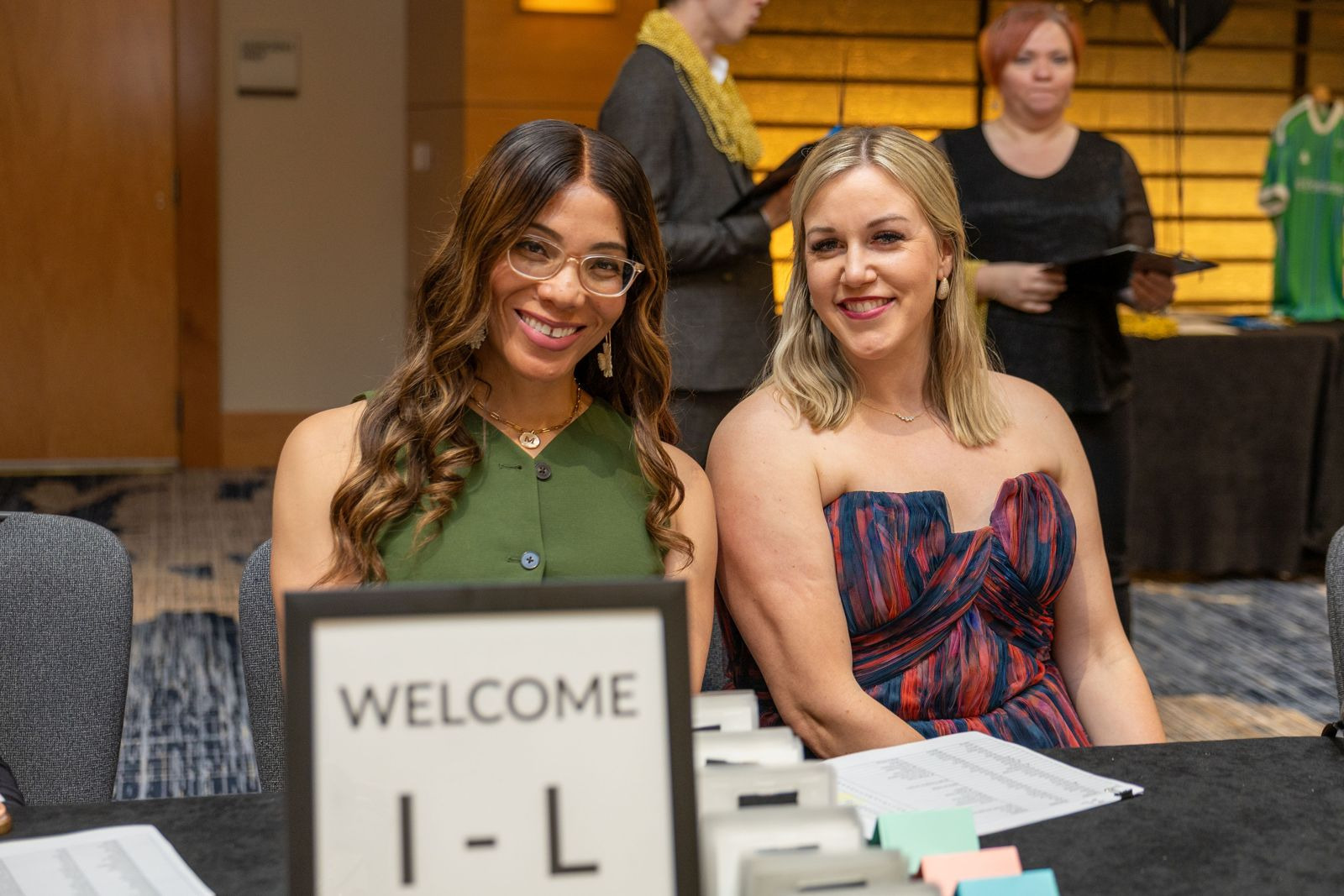 Sarah Martinez, Director of Sales and Membership, at the registration table at a Chamber event