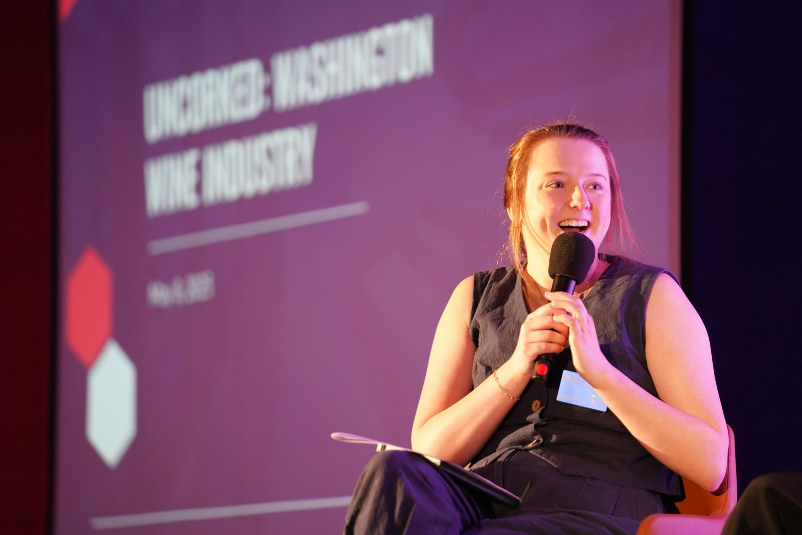 Sam Jones, Director of Communications, on stage during the Executive Business Roundtable program