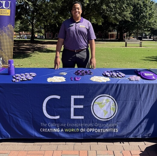Roz Burgess representing CEO at an ECU campus tabling event with branded materials
