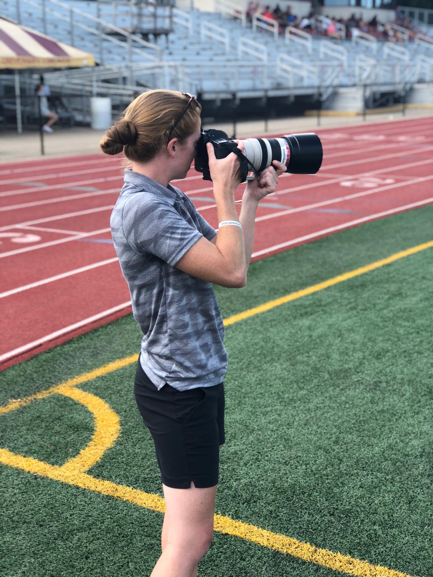 Gariglio taking sideline photos.
