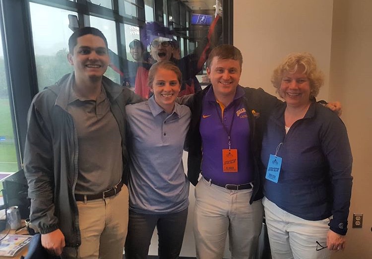 Gariglio and fellow SIDs at a 2018 NCAA tournament lacrosse game at UAlbany.