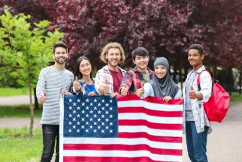 Students holding American flag