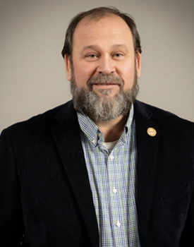 white man with smiling face. Facial hair