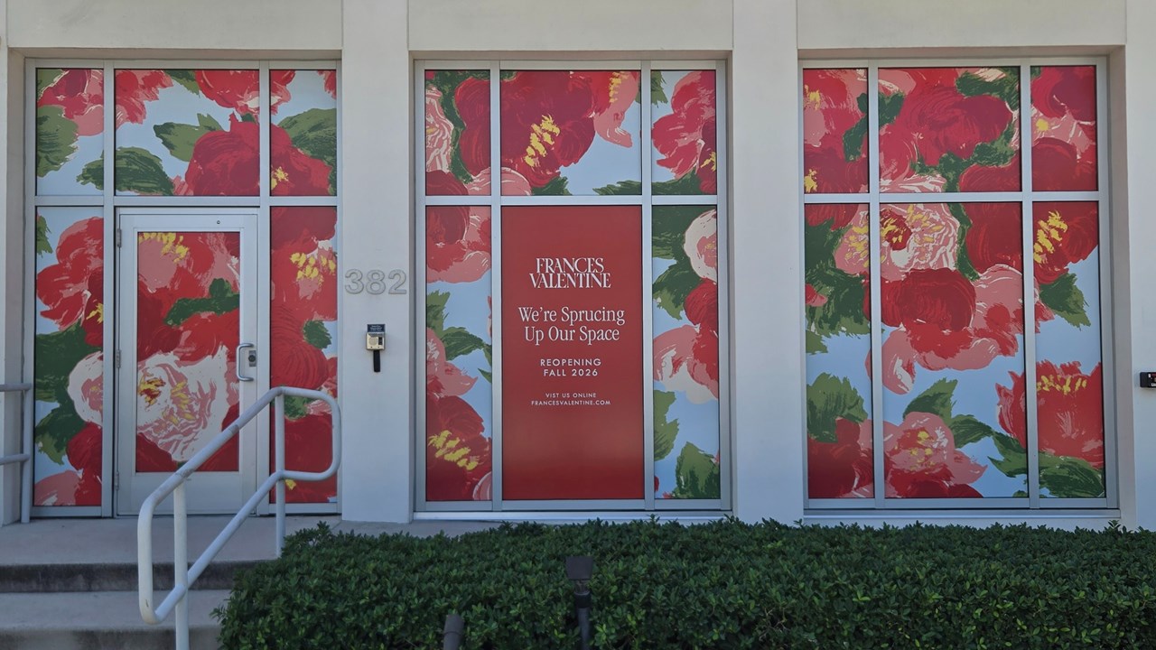 Temporary static cling applied to showroom windows