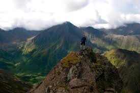 Man on top of an Alaskan mountain