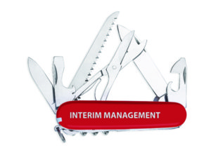 Swiss Army knife with the words "Interim Management" on the side