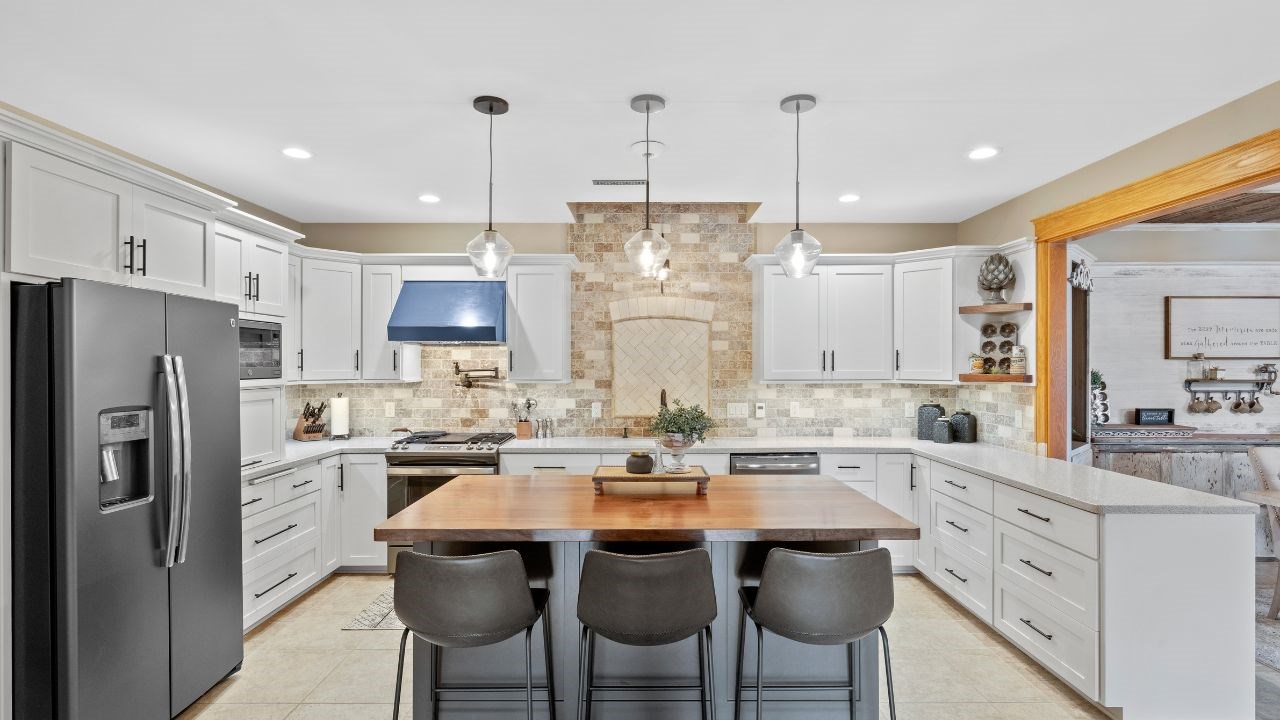 A Kitchen Refresh with White Cabinetry and Stainless Steel Appliances