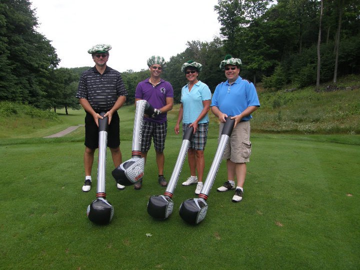 People golfing