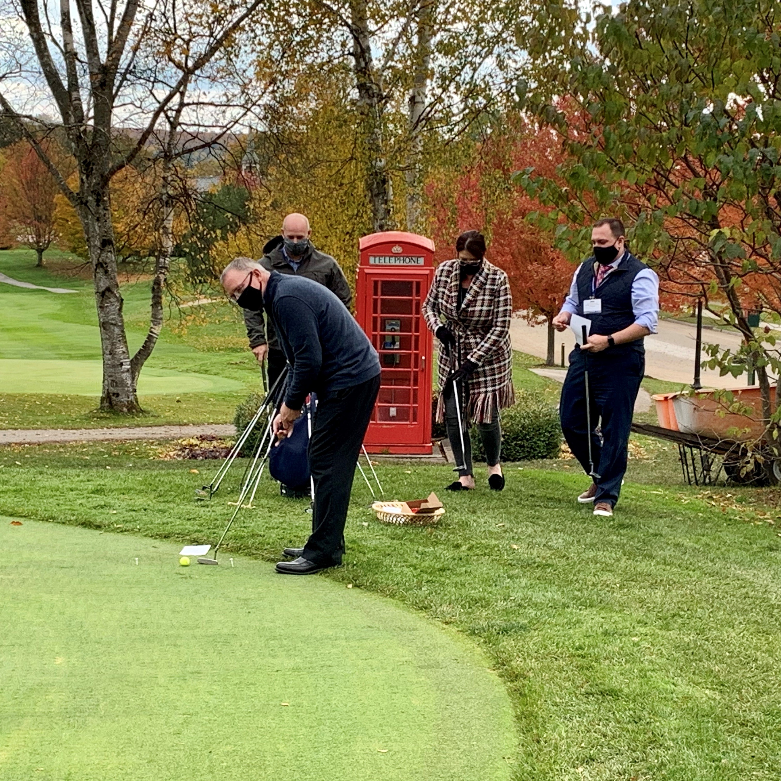 People practicing putting