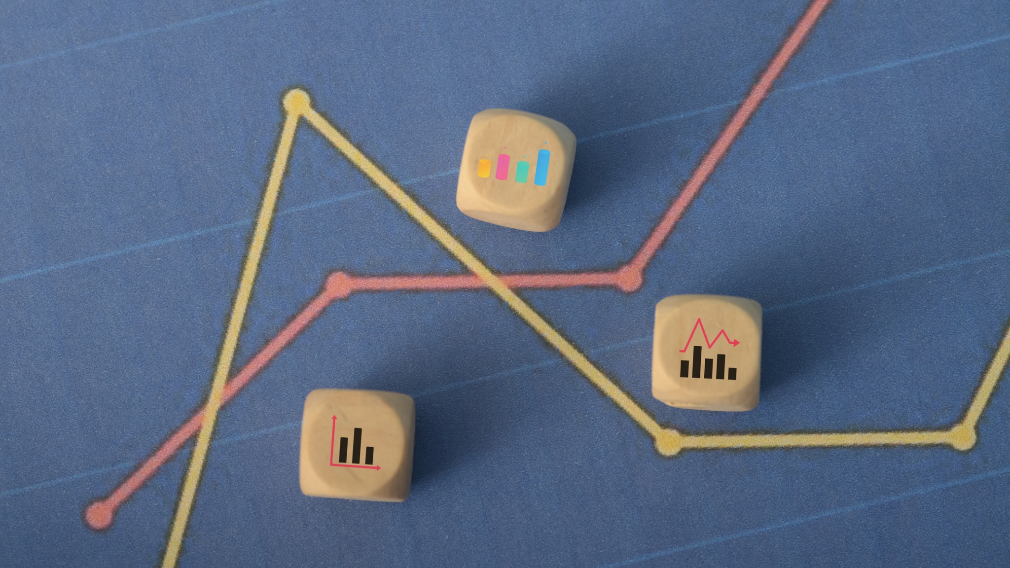 Wooden blocks with chart icons and trend lines on a blue background.
