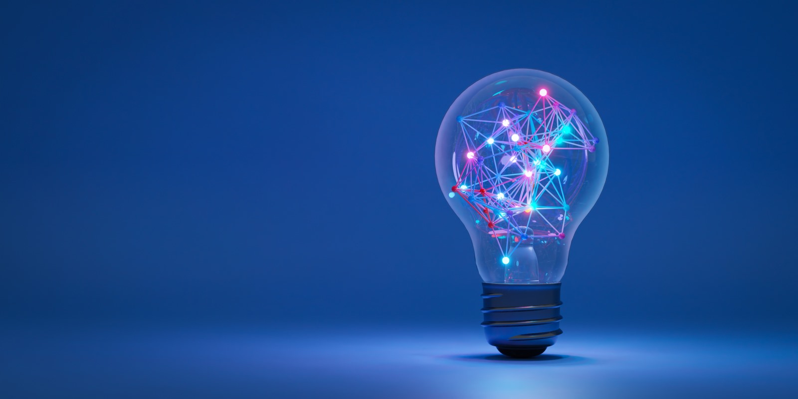 Glowing brain-shaped lightbulb illustration against a blue technology background.