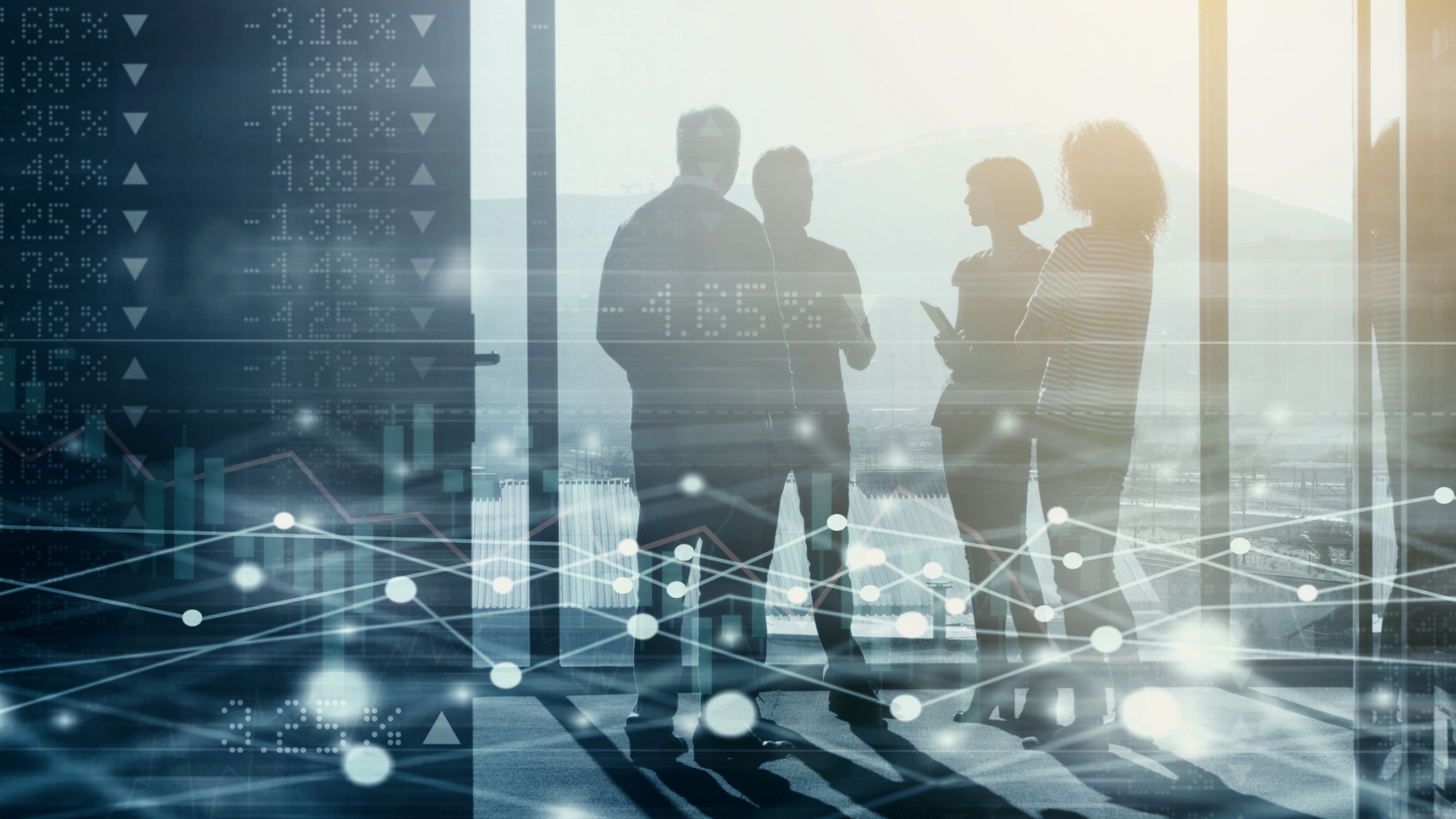 Silhouetted businesspeople with financial data overlays in a modern office setting.