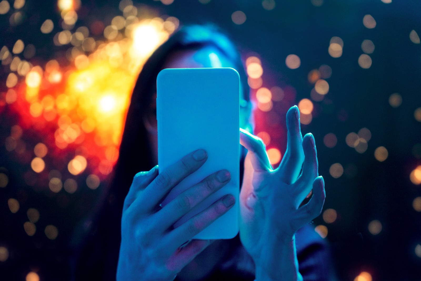 A woman holding a smart phone with stylized graphics