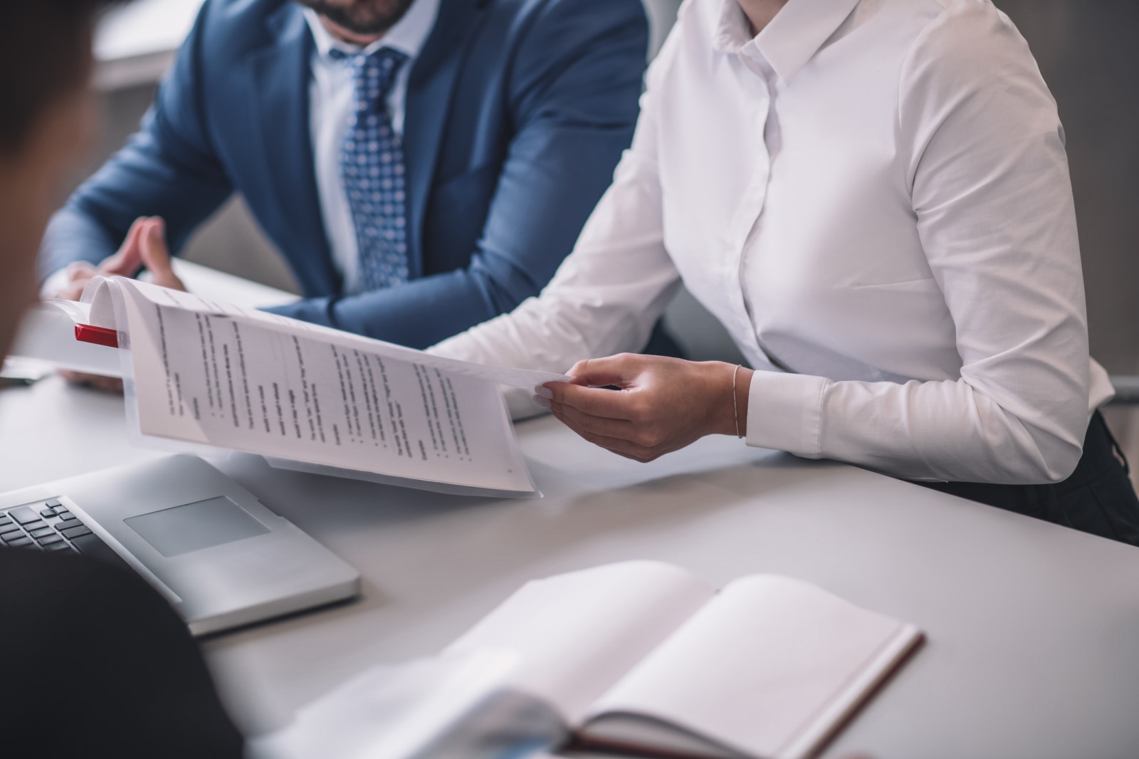 Investment professionals reviewing lending documents