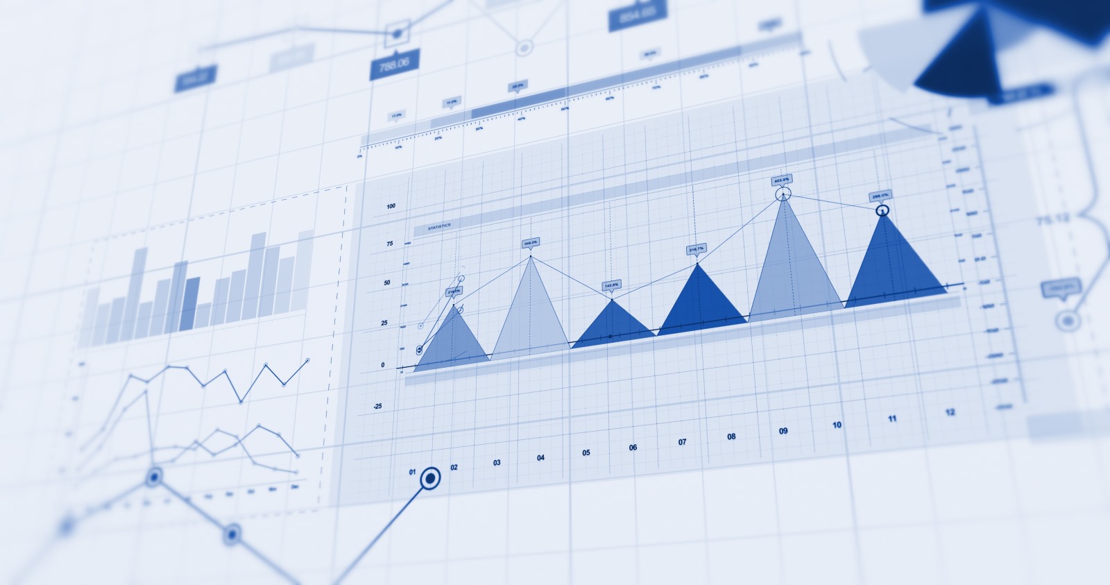 Financial charts and stock market projection in blue against a paper background