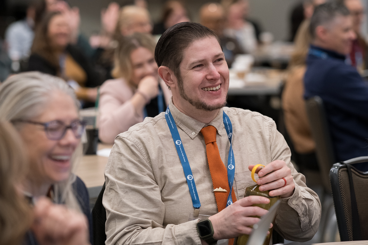 Jonathan Yost, Oregon PERS, reacts during the Communications & Member Services Summit