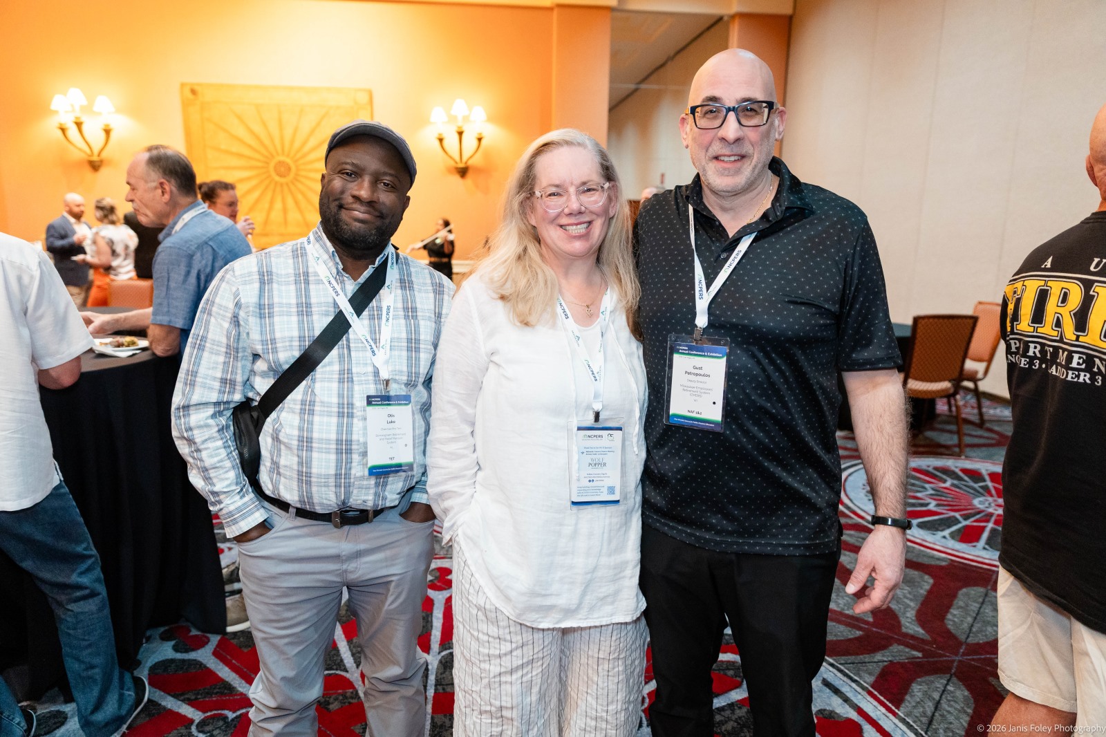Portrait of three attendees at a networking reception