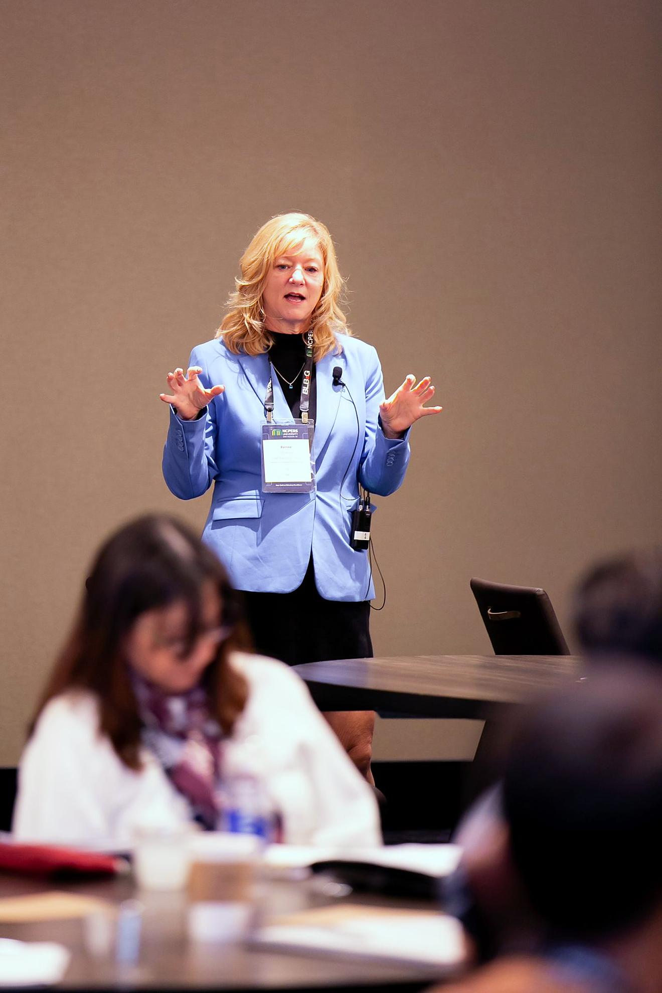 Presenter standing and instructing a session
