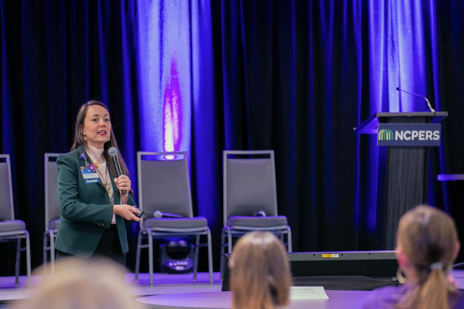 Presenter standing on stage at the 2026 Public Pension HR Summit