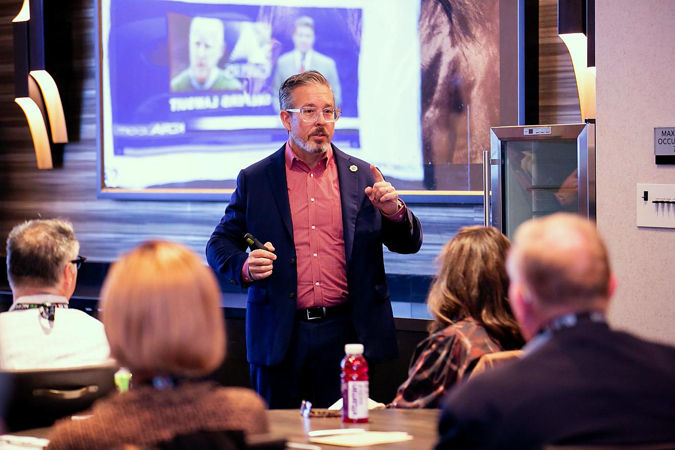 Presenter speaking in front of an audience