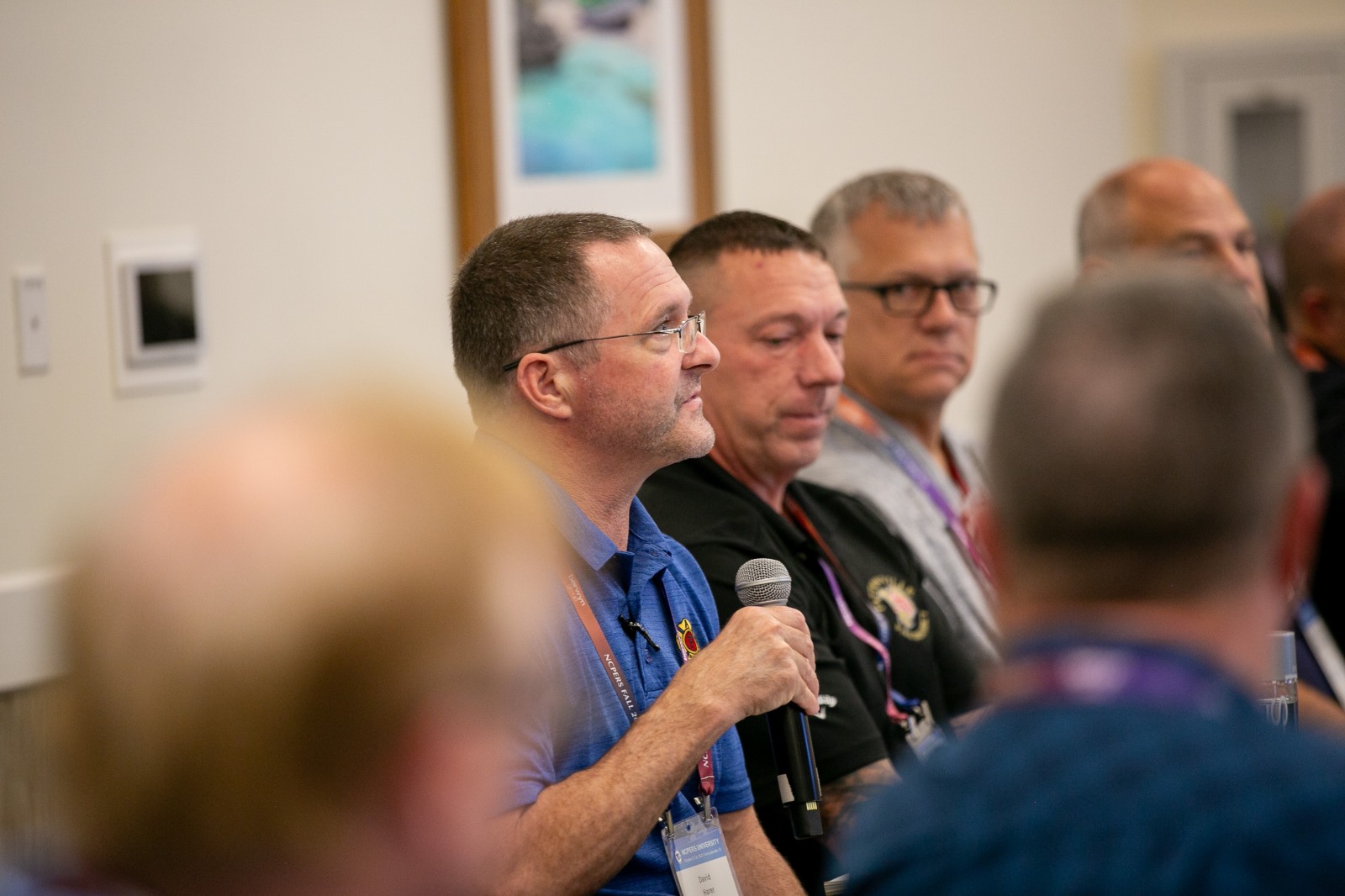 Firefighter David Harer engages in a small classroom setting, part of NCPERS University
