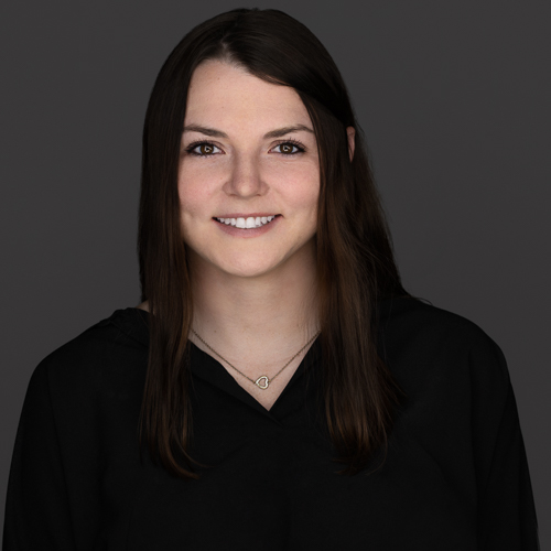 Professional headshot of Emma McKinney with Positive Tomorrows