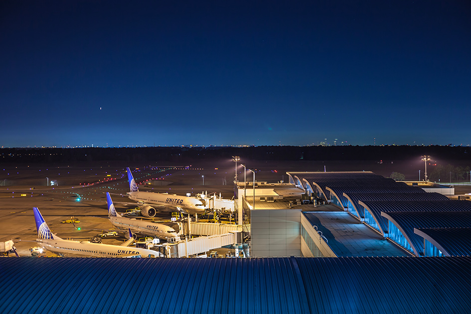 Airplanes lined up at an airport