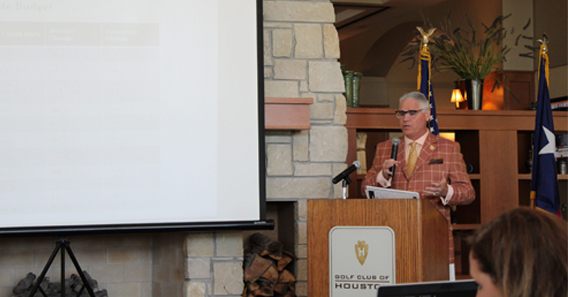 Man standing at podium giving a presentation