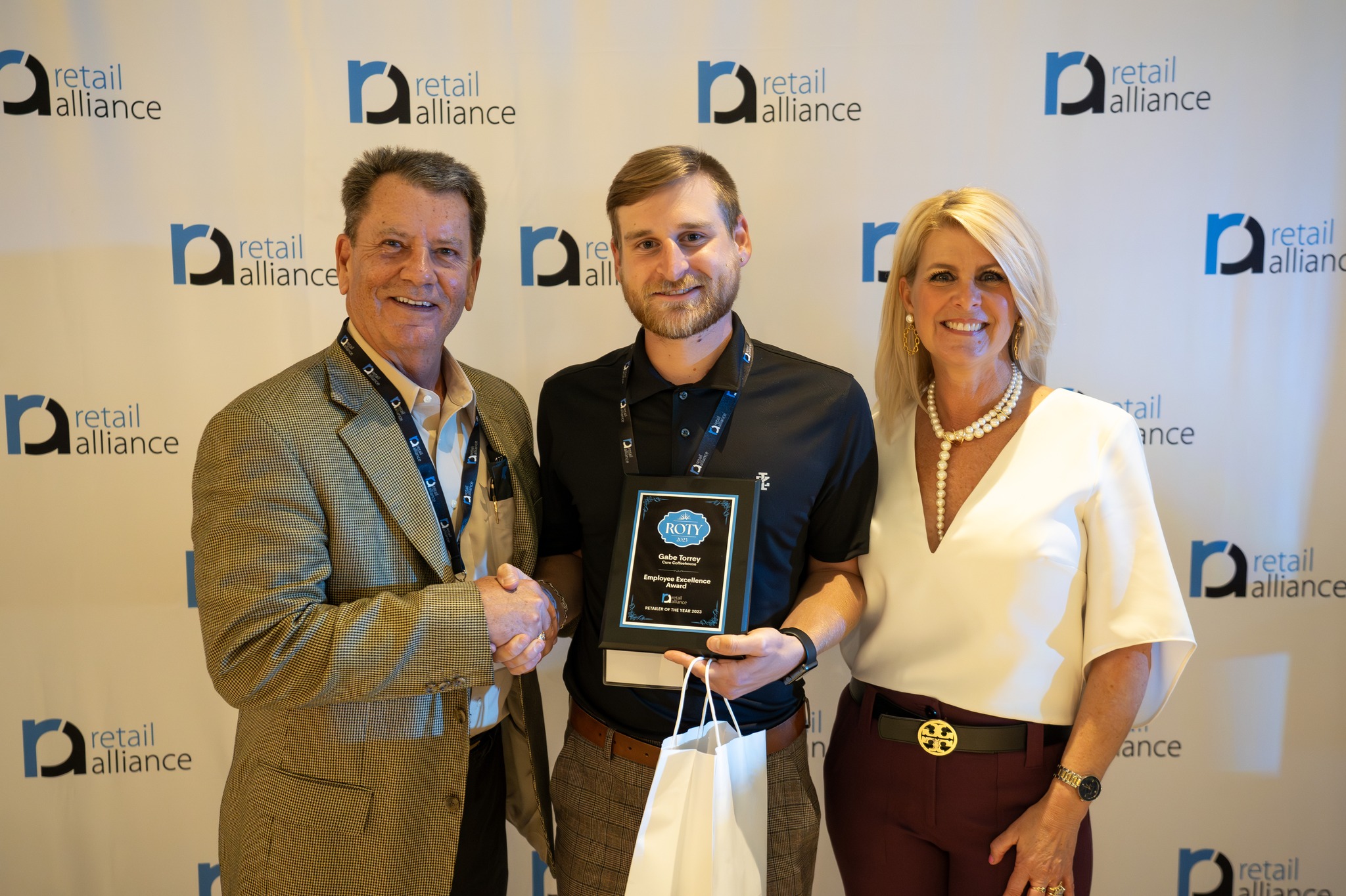 Photo of Gabe Torrey and Cure Coffeehouse co-owner Chris Shelton at Retailer of the Year