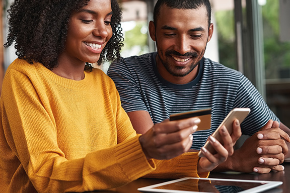 Couple purchasing items with a credit card