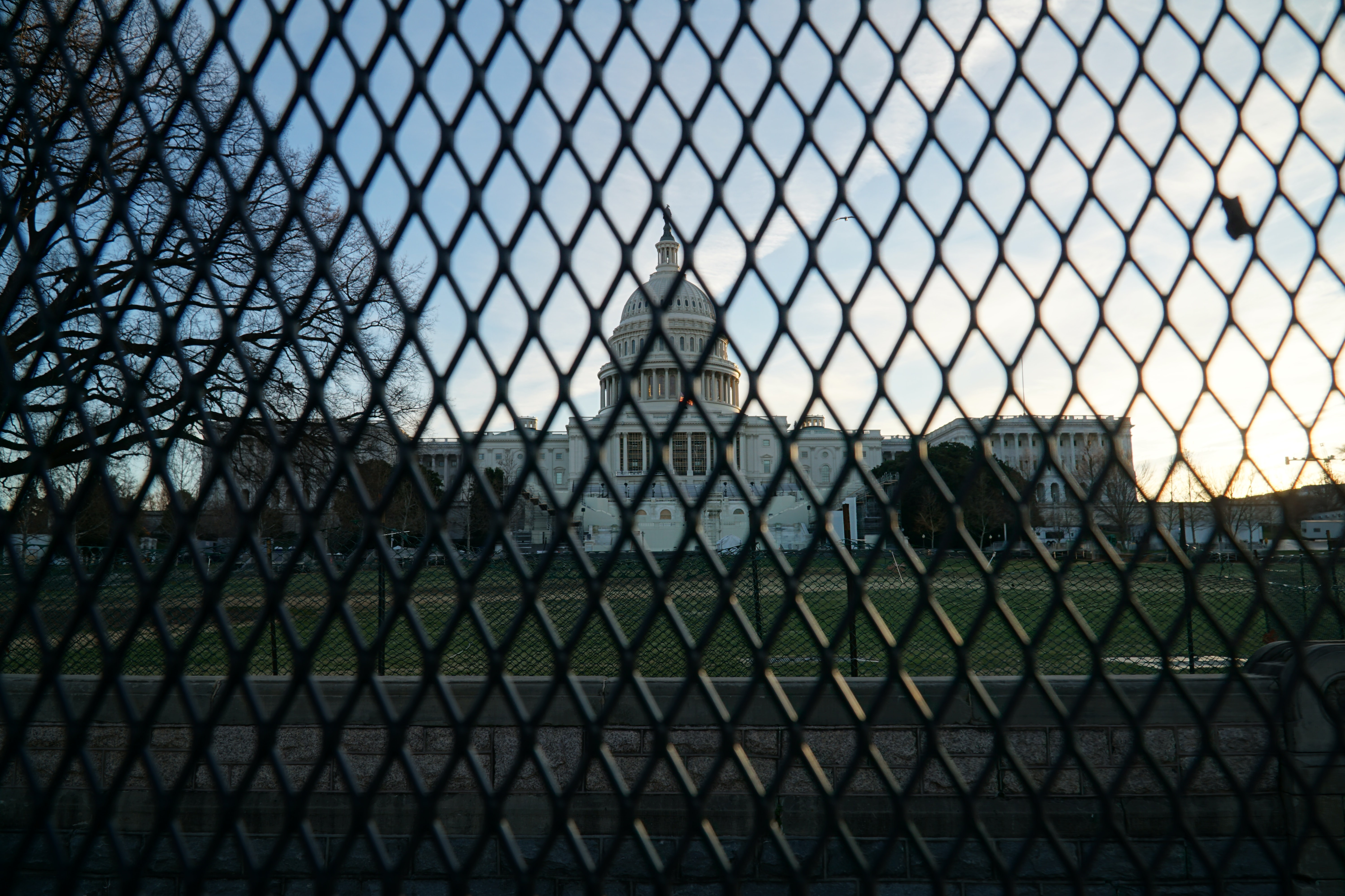 capitol building behind a fence