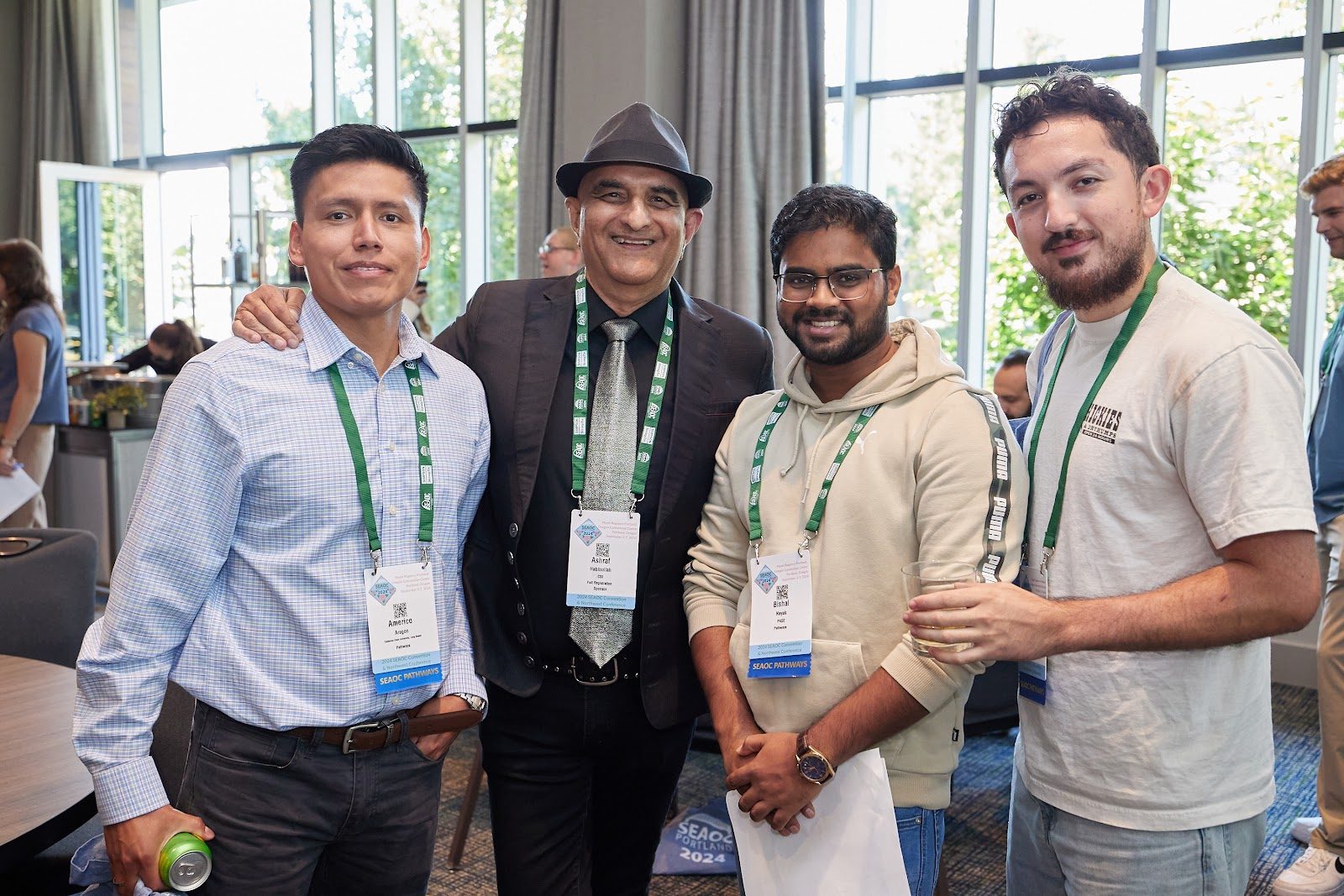 Four Pathways participants posing together at a convention reception