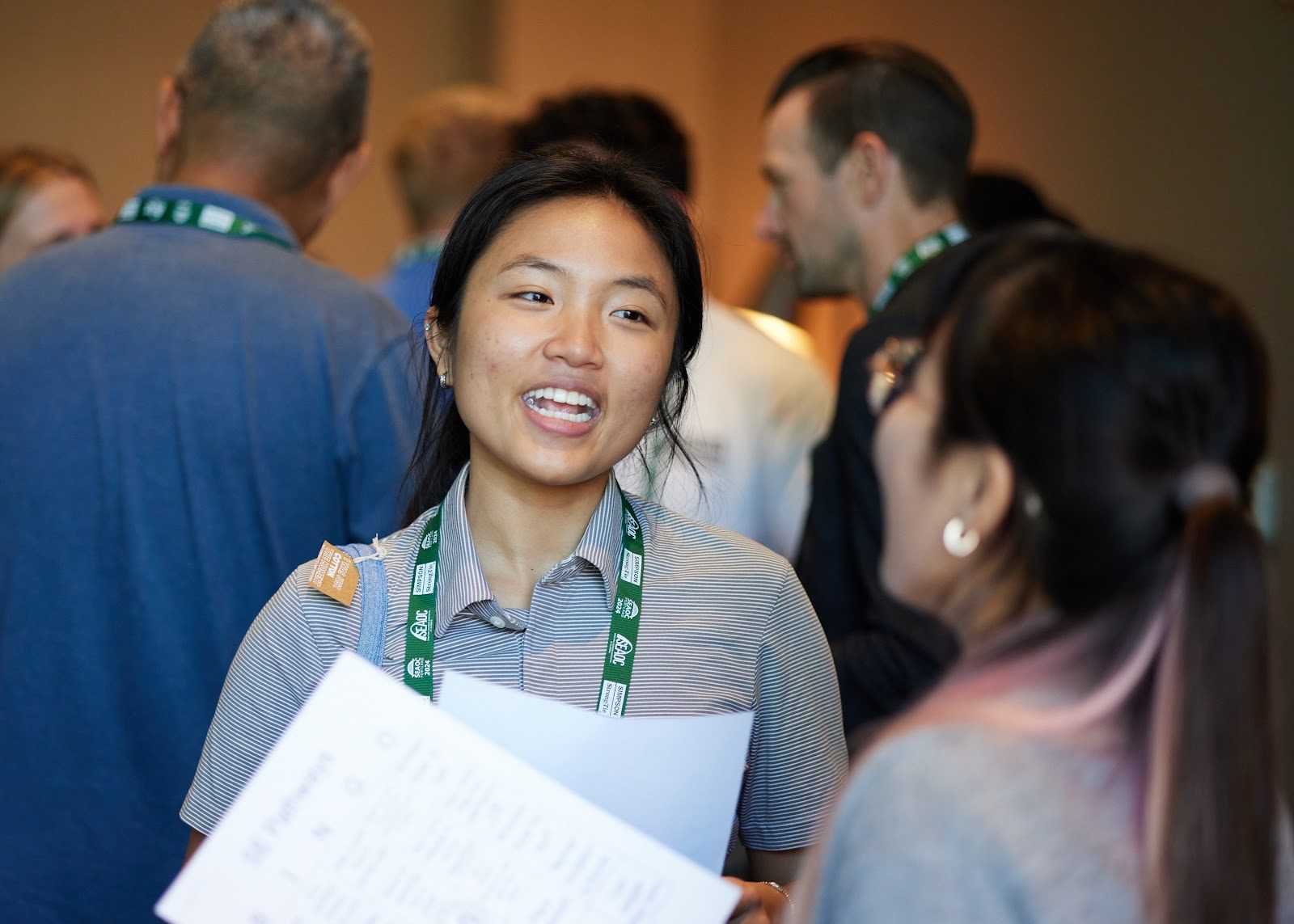 A cohort member laughing during a networking activity