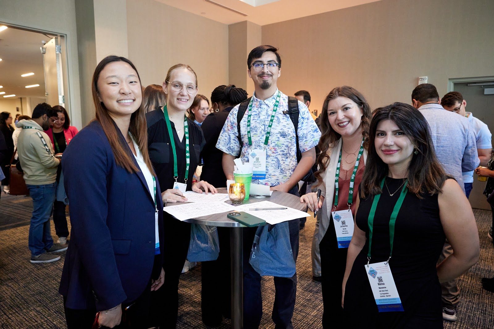 A group of Pathways cohort members gathered around a table during a convention reception