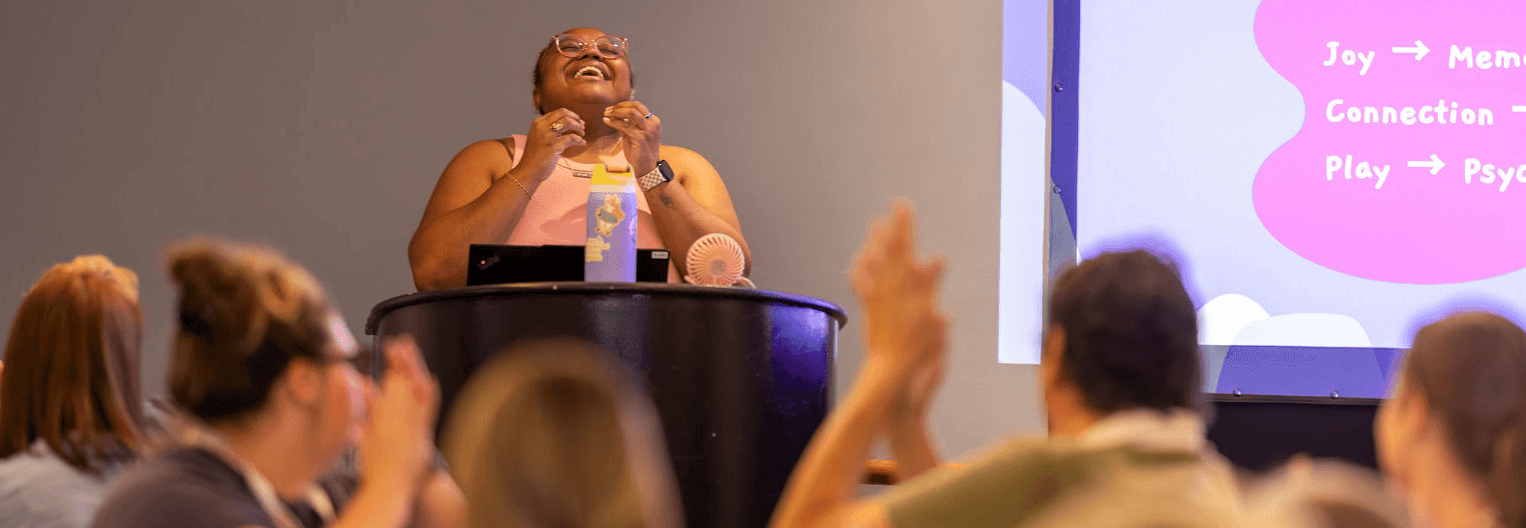 Chanel Sudds presenting in front of a room at the 2025 National Conference